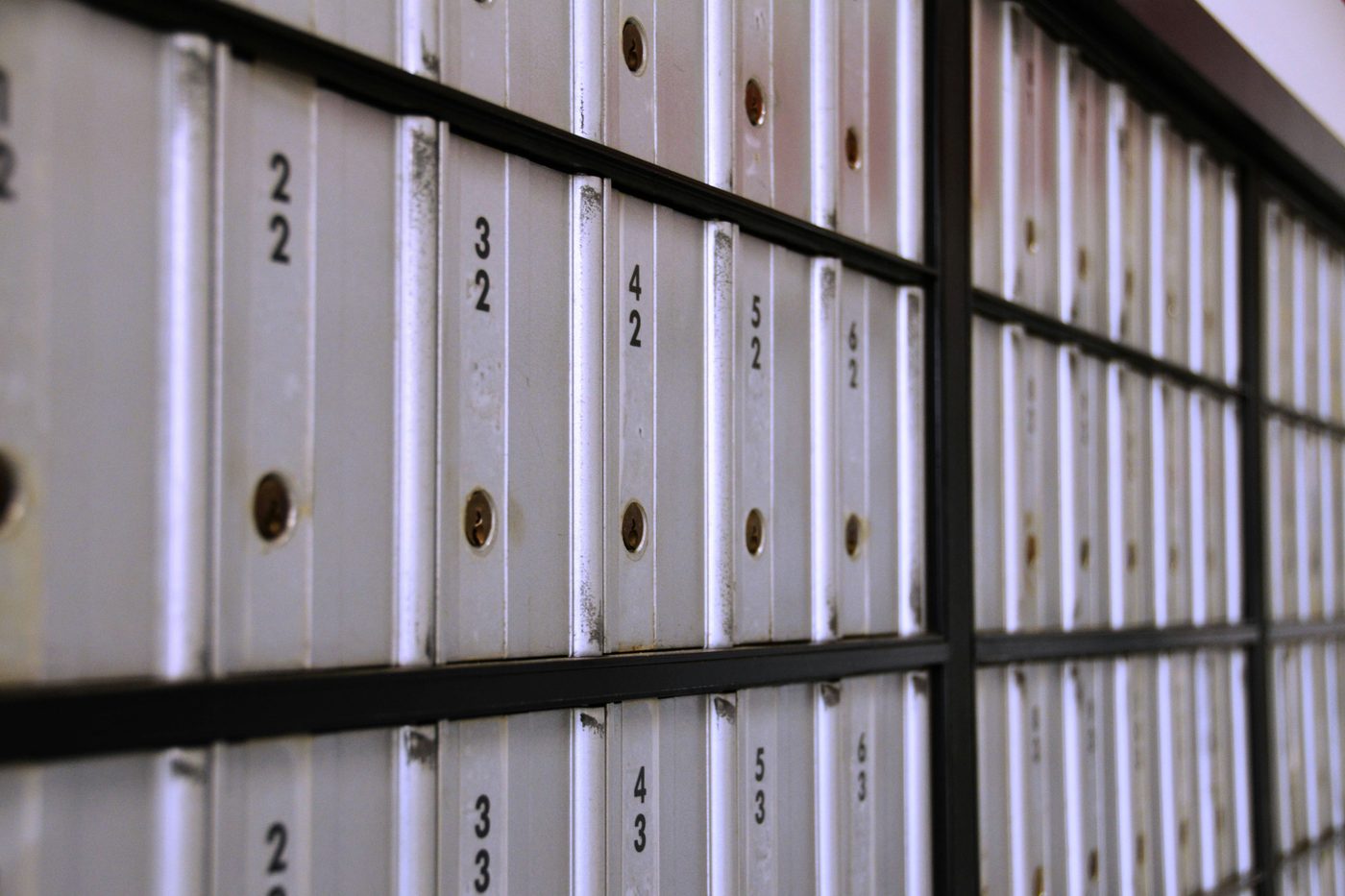 Rows of neatly numbered archive boxes on shelving